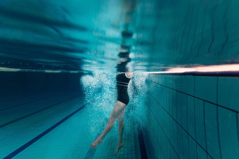 Woman treading water in a swimming pool